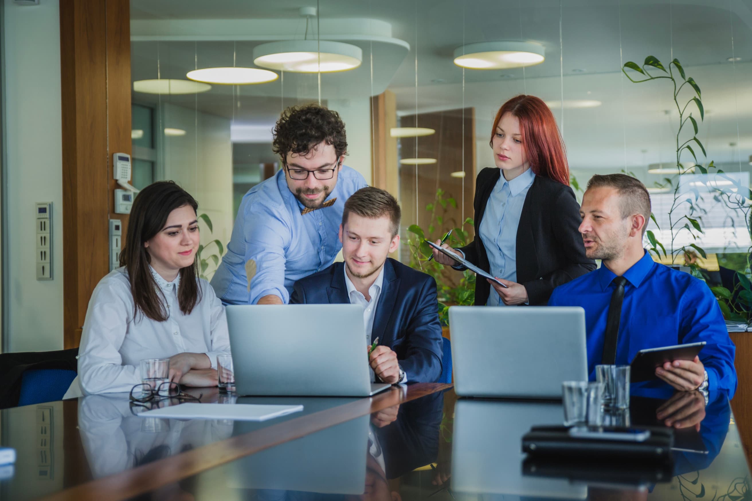 Obrofy strategists reviewing campaign results together at their laptops